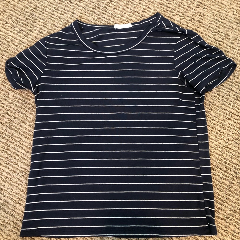 a kids Tilly’s navy blue and white striped shirt